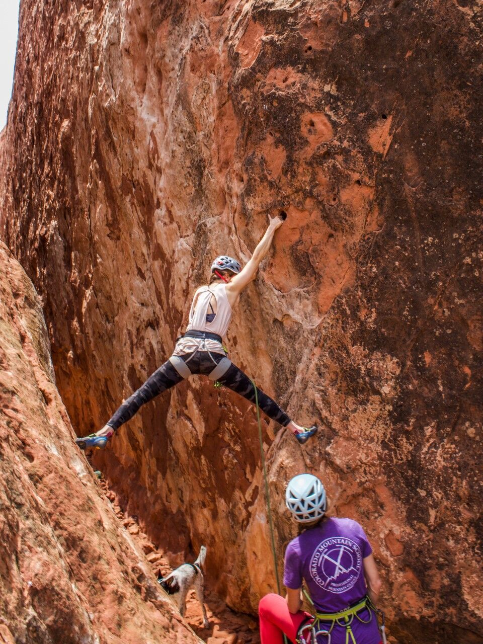 Sarah belays Paige Claassen as she sets up a hueco-heavy route in Colorado Springs' Garden of the Gods. Photo Credit: Michael Imes.