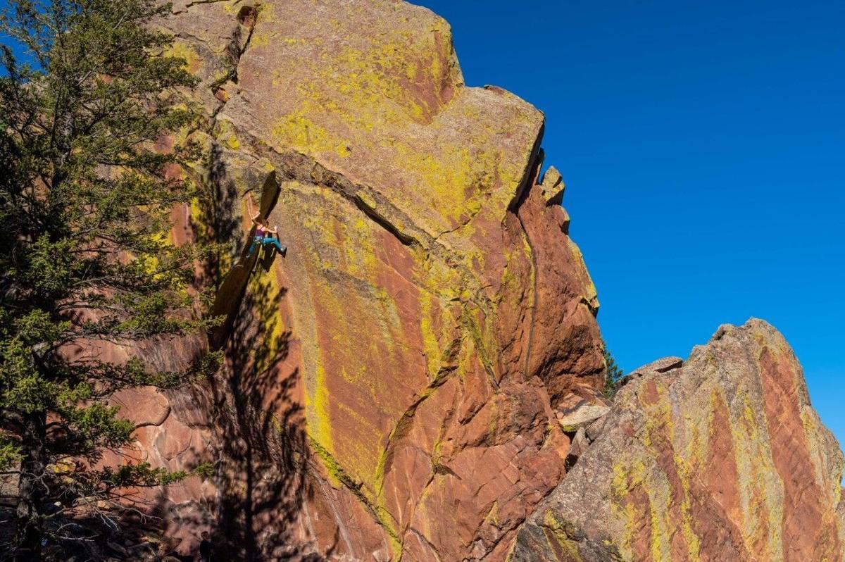 Paige makes a rare ascent of The Fiend (5.13c), a double overhanging dihedral in Boulder’s flatirons, first established by Dan Michael in 1987. Photo Credit: Arjan de Kock.