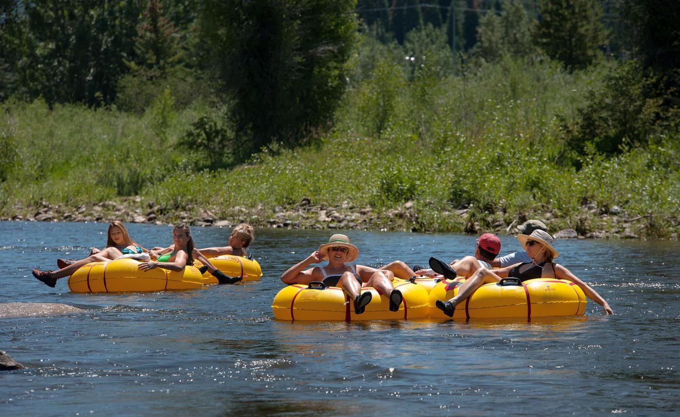 People float the Yampa River through downtown Steamboat Springs Saturday, Aug. 2, 2014, on a warm summer afternoon. (The Gazette, Christian Murdock)