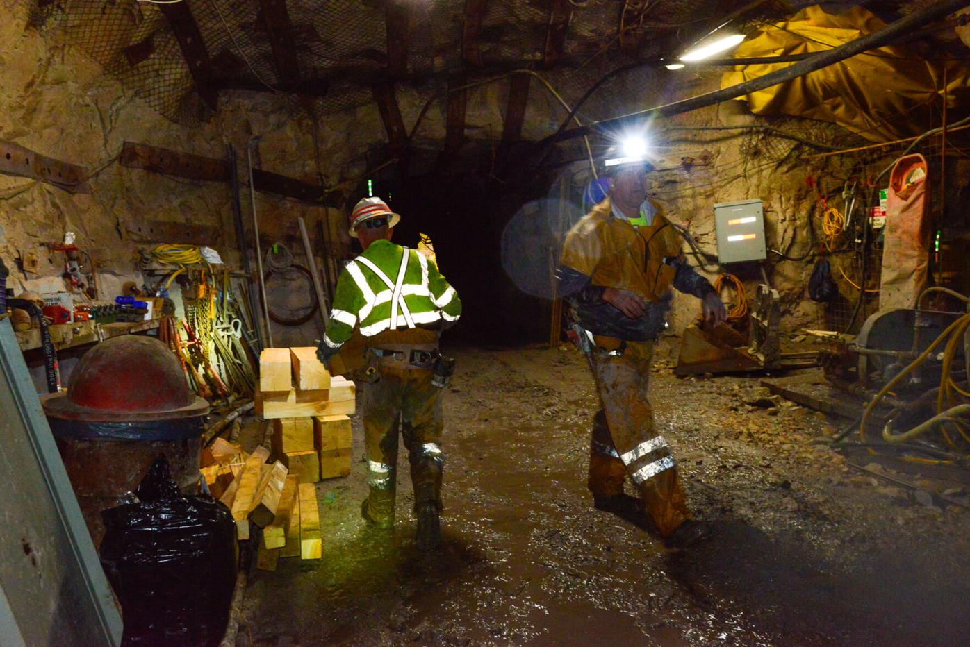 Miners stack cribbing blocks at the Pinyon Plain Mine.jpg