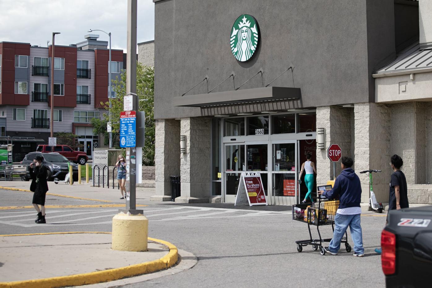 Customers enter a grocery store