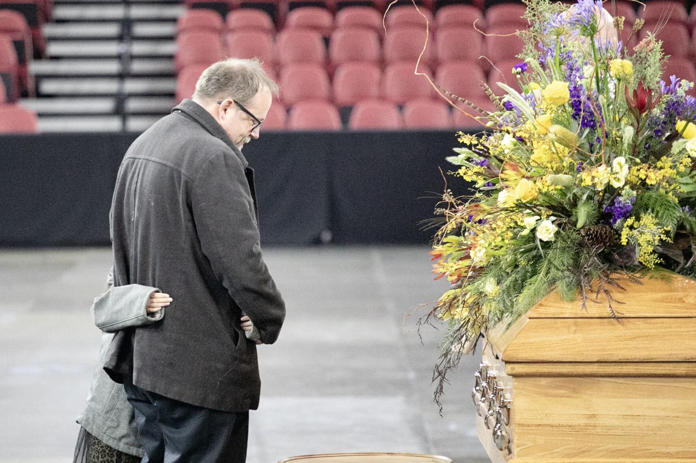 Tom Ritchie and his daughter, Tamriel, pay respect to Tom's uncle, the late Daniel Ritchie