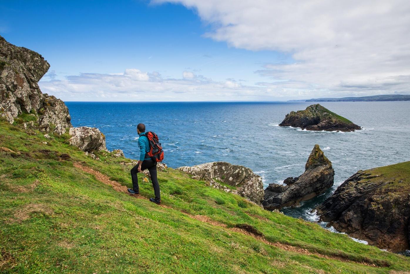 ManWalkingCornwallCoast
