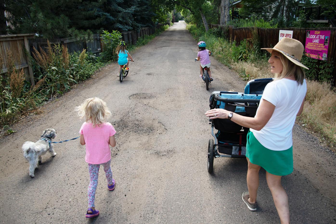 Tracy Murphy, right, walks with her children