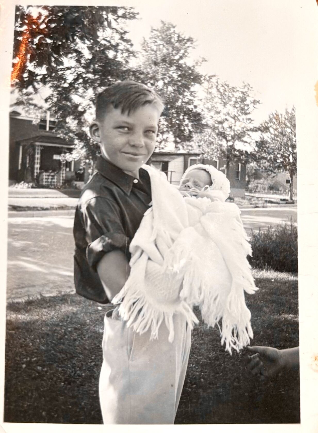 Ralph Moore holding brother